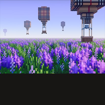 Hot air balloons soaring over a field of green and purple flowers